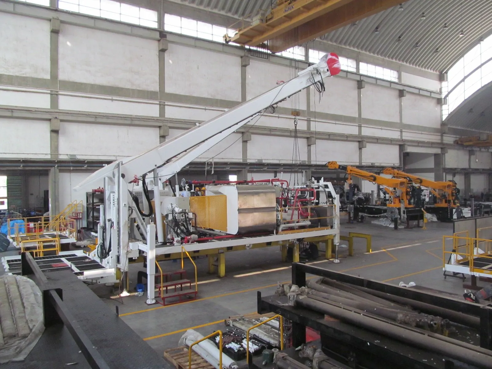 HYDCO main assembly hall at Chhatral — a rig under assembly beneath the overhead crane