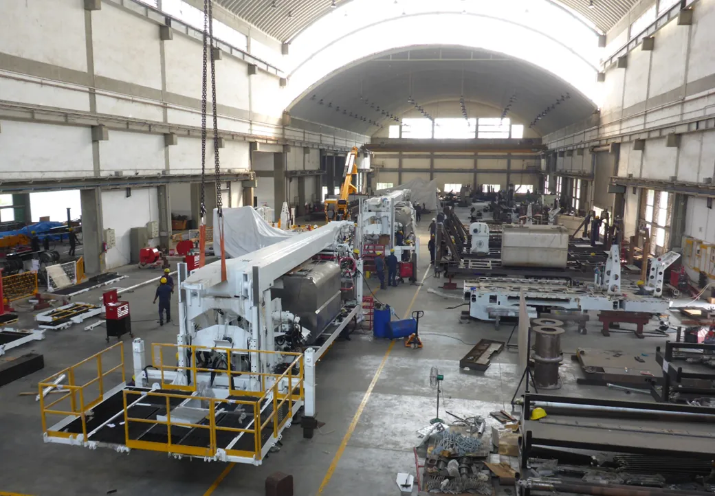 HYDCO main assembly hall at Chhatral — rigs under assembly down the full length of the hall